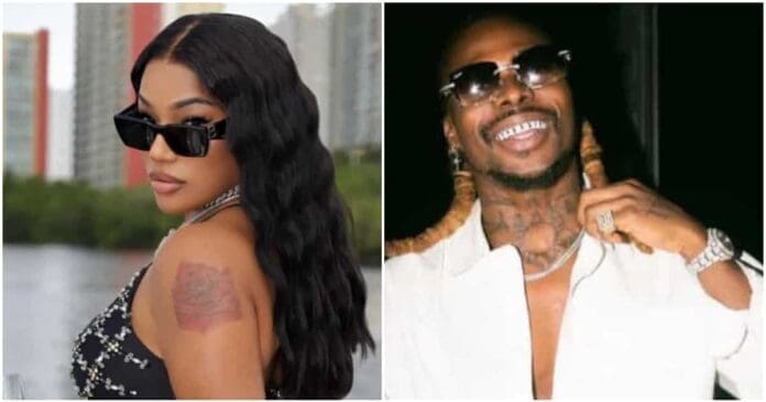5943339f940a6bdf.jpg A man and woman, reminiscent of a Stefflon Don and Asake collaboration, posing for a picture as if capturing a moment straight out of an iconic music video.