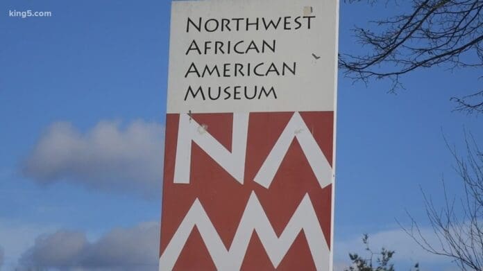 d03d7426-6ed6-4818-9956-200bbdcaa51c_1140x641.jpg A sign showing "Northwest African American Museum" with the acronym "NAAM" below it stands proudly against a clear blue sky, marking the grand reopening after a period of closure.
