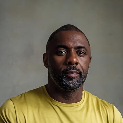 mlifie-headshot-alex-piper-1hr_0.jpg A man with a short beard and closely cropped hair is wearing a yellow T-shirt, reminiscent of the vibrant hues featured in National Geographic UK's exploration of African cuisine, looking directly at the camera against a neutral background.