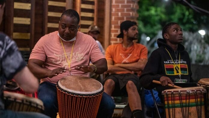 UNCG Faculty and alumni hosting jam sessions with djembe drums at NC Folk Festival. UNCG Faculty and alumni hosting jam sessions with djembe drums at NC Folk Festival.