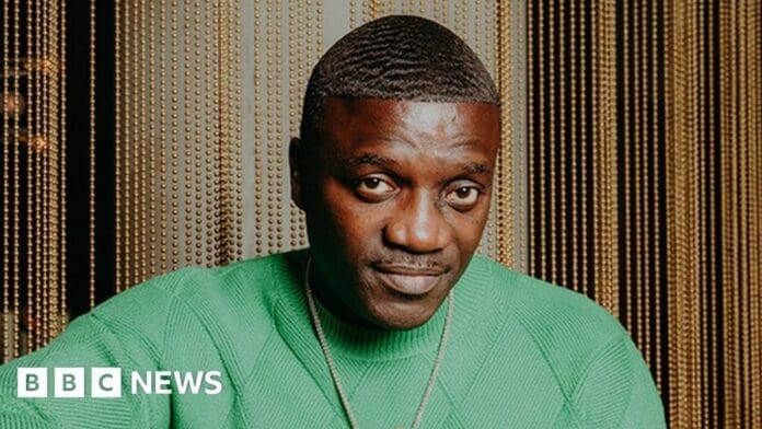 Man, green sweater, sitting Man, green sweater, sitting