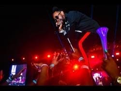A man performs at the Streetz Festival in Jamaica, thrilling audiences with his electrifying stage presence. A man performs at the Streetz Festival in Jamaica, thrilling audiences with his electrifying stage presence.