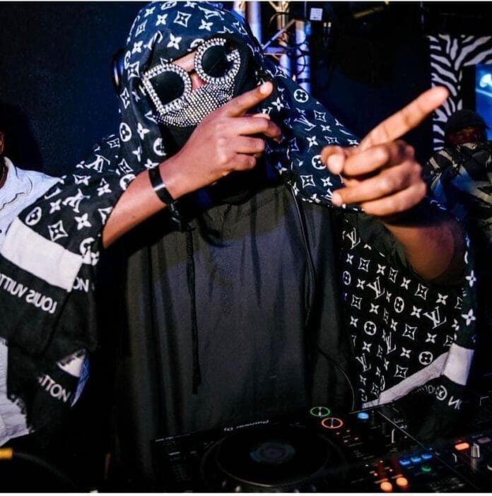 Masked star DJ NFT points at international gig attendees. Masked star DJ NFT points at international gig attendees.