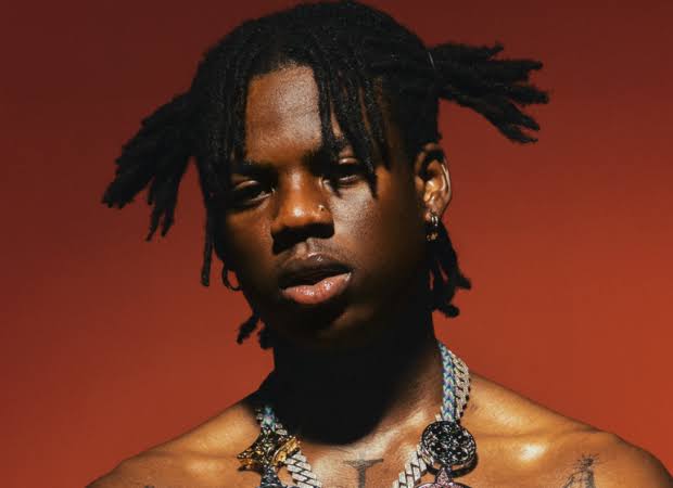 A man with dreadlocks and tattoos is featured on Rema's 'Calm Down,' one of Spotify's most streamed Afrobeats songs. A man with dreadlocks and tattoos is featured on Rema's 'Calm Down,' one of Spotify's most streamed Afrobeats songs.