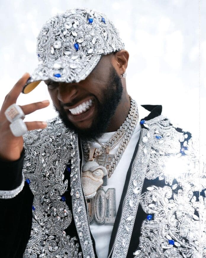 A man wearing a silver jacket. A man wearing a silver jacket.