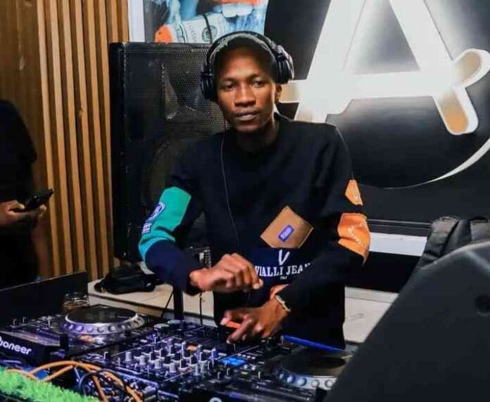 A man in a DJ booth with headphones on mixing Amapiano music. A man in a DJ booth with headphones on mixing Amapiano music.