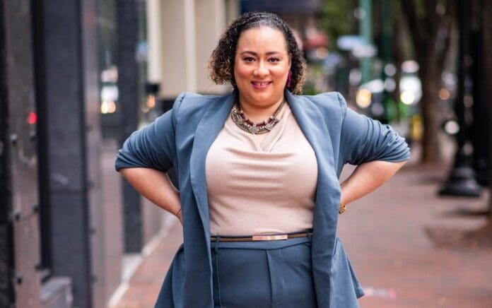 A woman donning a blue blazer. A woman donning a blue blazer.