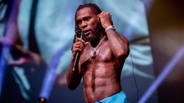 a man with dreadlocks holding a microphone a man with dreadlocks holding a microphone