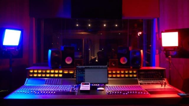 A recording studio with red and blue lights, perfect for aspiring musicians and artists at EMPIRE. A recording studio with red and blue lights, perfect for aspiring musicians and artists at EMPIRE.