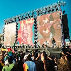 A Star-Studded Lineup of people on a stage at Afro Nation Portugal festival. A Star-Studded Lineup of people on a stage at Afro Nation Portugal festival.