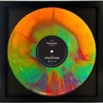 Afropop-African Music Vinyl record with a vibrant geometric-patterned cover. An exploration of diverse genres and pays homage to the rhythmic brilliance of African musicians.