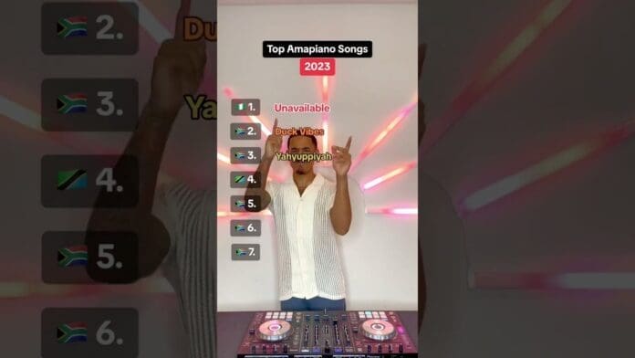 A person stands behind a DJ controller, pointing upward beside a ranked list titled "Top Amapiano Songs 2023," featuring top Amapiano songs and flags shown on the left.