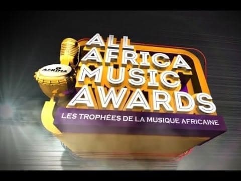 Logo for the All Africa Music Awards (AFRIMA) with a golden microphone, highlighting African Music and featuring text in English and French: "Les Trophées de la Musique Africaine." UK Partner collaboration included.