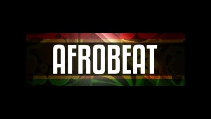 The word "AFROBEAT" in bold white capital letters is centered against a dark, multicolored background with subtle red, yellow, and green hues, celebrating Afrobeats and its vibrant influence across Africa's music scene.