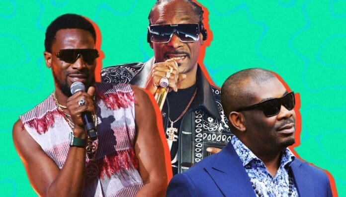 Three men wearing sunglasses pose against a bright turquoise background; channeling Afrobeats style, one holds a microphone and wears a sleeveless shirt, another sings, and the third—dressed in a suit jacket—exudes D’banj-like cool.