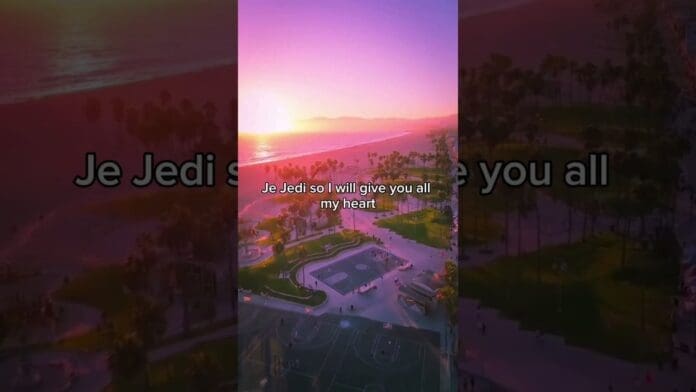 A sunset over a coastal park with basketball courts, palm trees, and the ocean, overlaid with song lyrics "Je Jedi so I will give you all my heart" in the center, inspired by CalledOut Music’s uplifting afrobeats style.