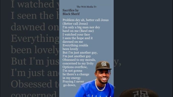 A man in a blue shirt and cap smiles in front of overlaid "Sacrifice" lyrics by Black Sherif, with vibrant Afrobeats energy, all displayed on a dark background.