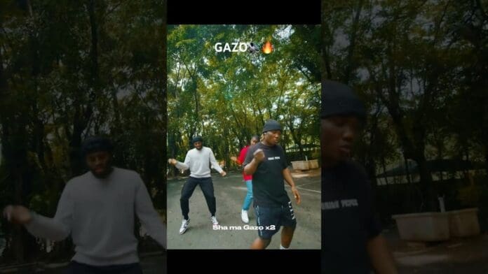 Three people dance on an outdoor path surrounded by trees. White text at the top reads "GAZO" with a fire emoji, and lyrics "Sha ma Gazo x2" appear at the bottom, featuring vibes inspired by Mohbad and CDQ.