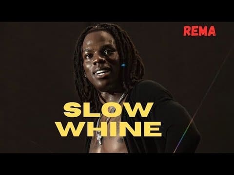 A person with dreadlocks stands against a dark background, highlighting the lyrics video for "Slow Whine," with "SLOW WHINE" in yellow and "REMA" in red text.