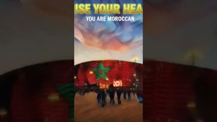 A group of people walk toward a building lit with a large green star and red background. Text at the top reads, "RISE YOUR HEAD... YOU ARE MOROCCAN.