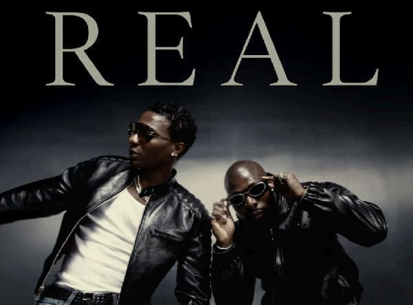 Two men wearing black leather jackets and sunglasses pose in front of a dark background with the large word "REAL" above them, channeling the bold style seen in African music stars like Wizkid.