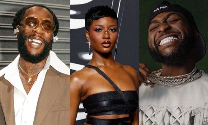 Three people pose for the camera: a man in a brown suit and sunglasses, a woman in a black dress, and a man in a white shirt and cap showing off his necklace—channeling the style of Burna Boy and Davido, Grammy Best African Music nominees.