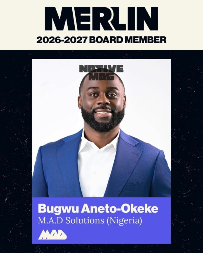 Bugwu Aneto-Okeke, a 2026-2027 MERLIN Board member from M.A.D Solutions (Nigeria), is shown in a blue suit and white shirt, smiling at the camera for NativeMag.