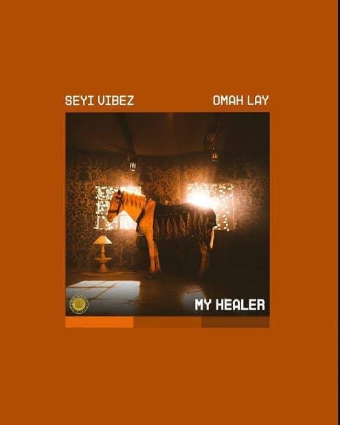 Album cover for "My Healer" by Seyi Vibez and Omah Lay, two Nigerian Afrobeats stars, featuring a horse standing in a dimly lit, decorated room with sunlight filtering through windows.