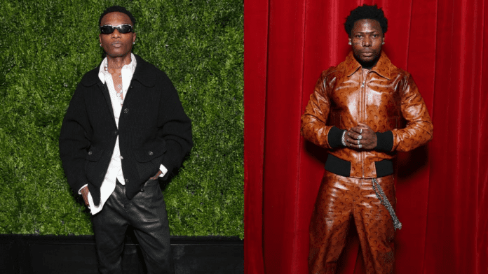 A man standing next to Wizkid, both stylishly dressed, could be hinting at an upcoming joint EP.