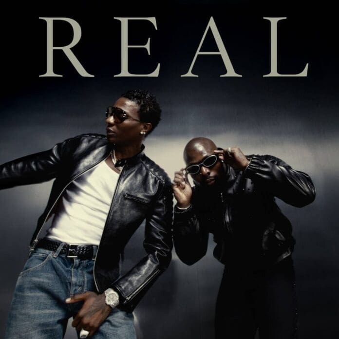 Two men wearing black leather jackets and sunglasses pose in front of a metallic background with the word "REAL" in large letters above them, channeling serious Asake and Wizkid vibes—it's the essence of REAL Vol. 1.