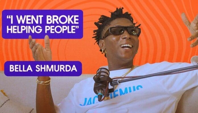 Bella Shmurda, Afropop star, wearing sunglasses and a white shirt, sits in front of a microphone with text stating "I went broke helping people.