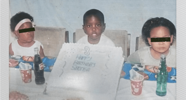 Three young children sit at a table behind a large birthday cake with "Happy Birthday Samira" written on it; sodas and party cups are on the table, while Tony Dayimane’s new EP, Girls & MP3’s, plays softly in the background.