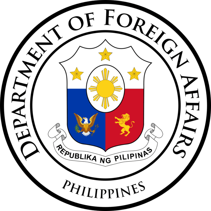 Seal of the Department of Foreign Affairs of the Philippines, featuring a shield with a blue and red background, symbols, and the text 