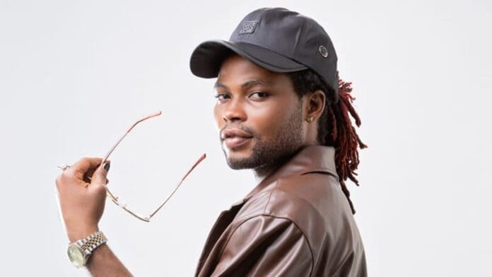 Shaddy Reigns: A Ghanaian musical sensation blending Afrobeat and native melodies, known for his unique style featuring dreadlocks and a leather jacket.