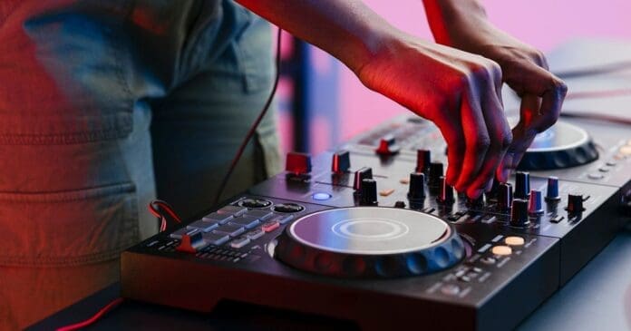 A dj is mixing Amapiano music on a dj mixer.