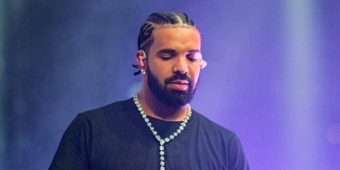 Drake performs at a concert. - Insider