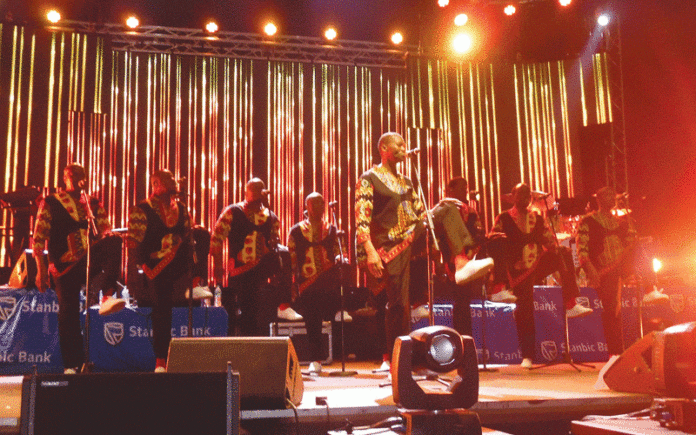 Musicians performing on stage during Jacaranda Fest.